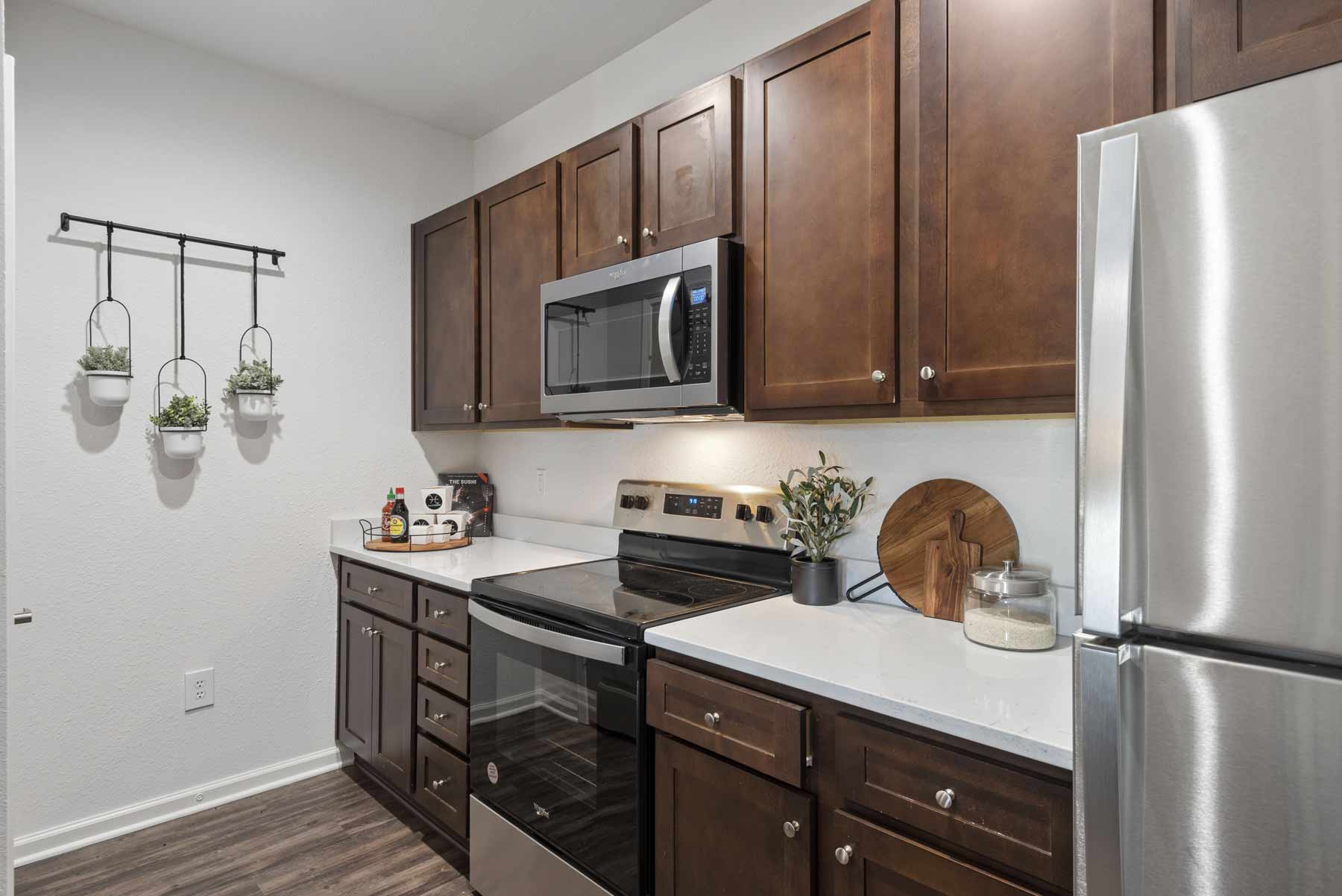 Kitchen with stainless steel appliances, quartz counter tops